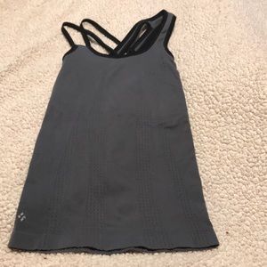 Great condition NUX size M featuring shelf bra and asymmetrical straps on back